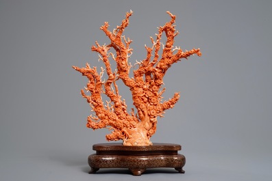 A Chinese carved red coral 'blossom tree' group on inlaid wooden stand, 19/20th C.